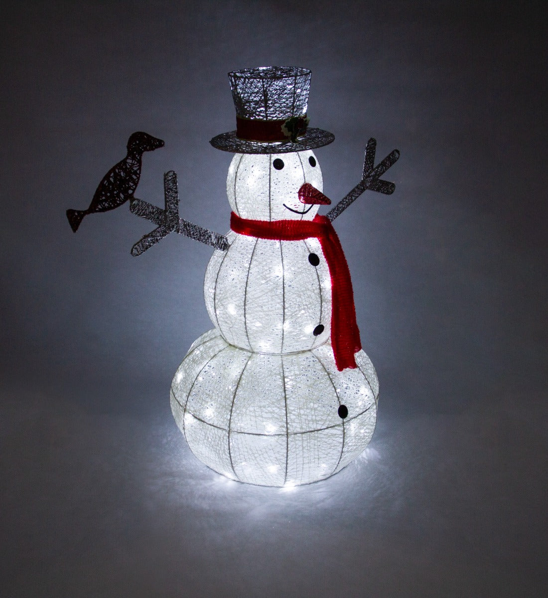 Brightly lit snowman with a black top hat, red scarf, and bird, featuring a textured white body and glowing LED lights