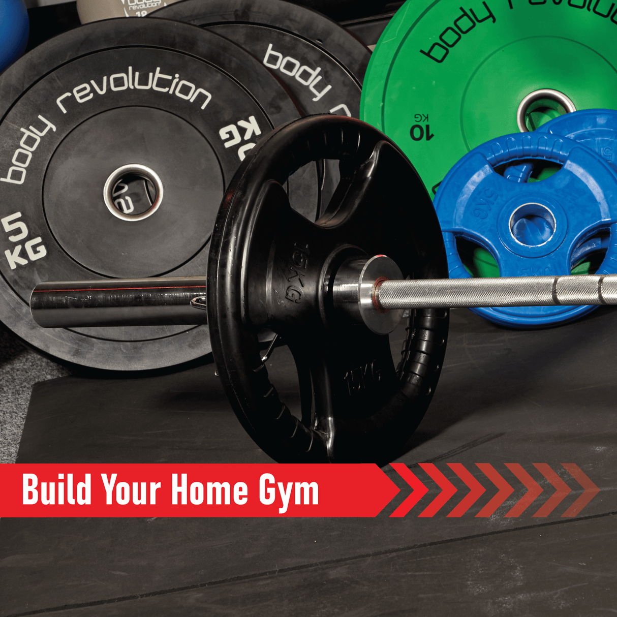 Black Olympic tri-grip rubber weight plates in various sizes, arranged around a barbell, showcasing durable texture and vibrant colors